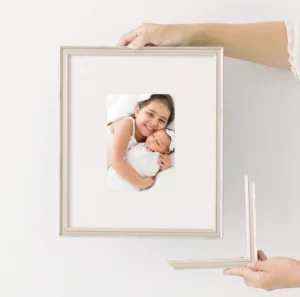 Framed family beach photography prints showcasing custom wall art in Sarasota home